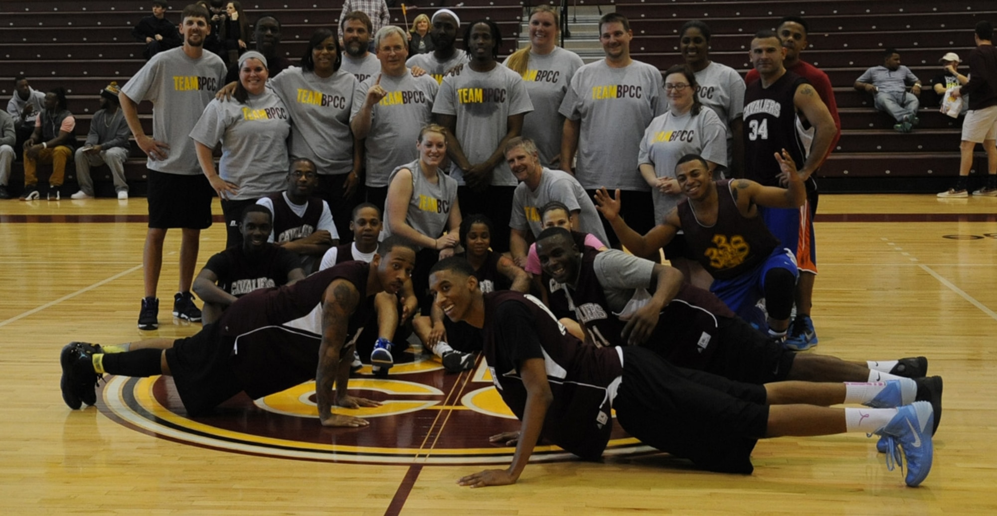 140125-F-SR682-187 Barksdale Air Force Base Airmen and Bossier Parish Community College faculty and staff pose for a photo during a basketball game at BPCC on Jan. 25, 2014. The game was held as a way for BPCC to show their support and respect for the men and women of Barksdale. (U.S. Air Force photo/Staff Sgt. Sean Martin)
