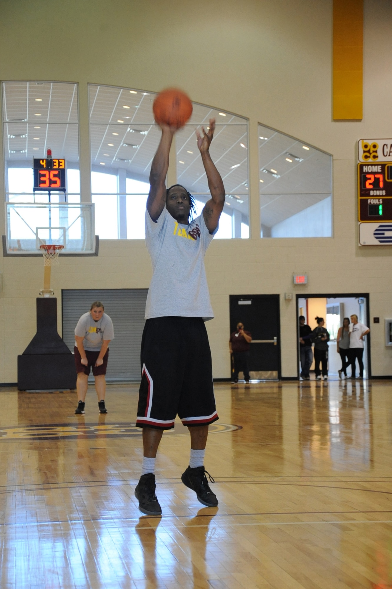 140125-F-SR682-080Brance Davenport, Bossier Parish Community College staff, shoots a free throw during a military appreciation basketball game between Barksdale Air Force Base Airmen and Bossier Parish Community College faculty and staff at BPCC, Jan. 25, 2014. Jim Henderson, BPCC chancellor, said that he hopes the basketball game can become an annual event between both teams. (U.S. Air Force photo/Staff Sgt. Sean Martin)