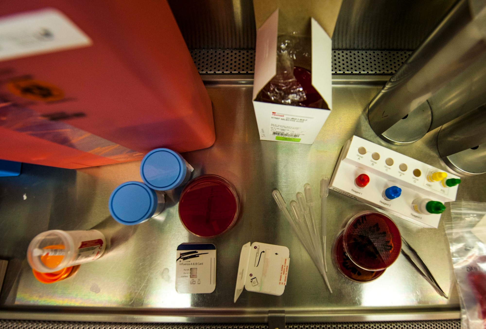 Pipets, petri dishes and other medical testing equipment sit in an enclosed testing area in the laboratory at Minot Air Force Base, N.D., Jan. 23, 2014. The equipment is used to test for a wide array of illnesses to include strep throat and influenza. (U.S. Air Force photo/Senior Airman Stephanie Sauberan)