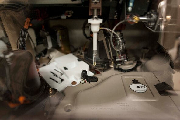 A Vitros 350 Chemistry Analyzer is used to test samples for blood abnormalities at Minot Air Force Base, N.D. Jan. 23, 2014.  Chemistry testing is used as one of the first methods of screening to assist a provider in deciding what additional testing must be ordered to diagnose a specific disease state in the patient. (U.S. Air Force photo/Senior Airman Stephanie Sauberan)