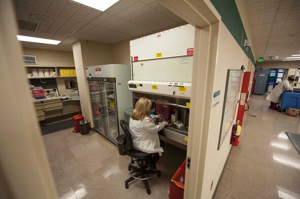 Lavon Slind, 5th Medical Group Laboratory Technical Supervisor, conducts tests to look for signs of Strep throat and Influenza in the laboratory at Minot Air Force Base, N.D., Jan. 23, 2014.  Ms. Slind works alongside a team of Airmen and civilians who test everything from nasal washings to blood samples and throat swabs. (U.S. Air Force photo/Senior Airman Stephanie Sauberan)