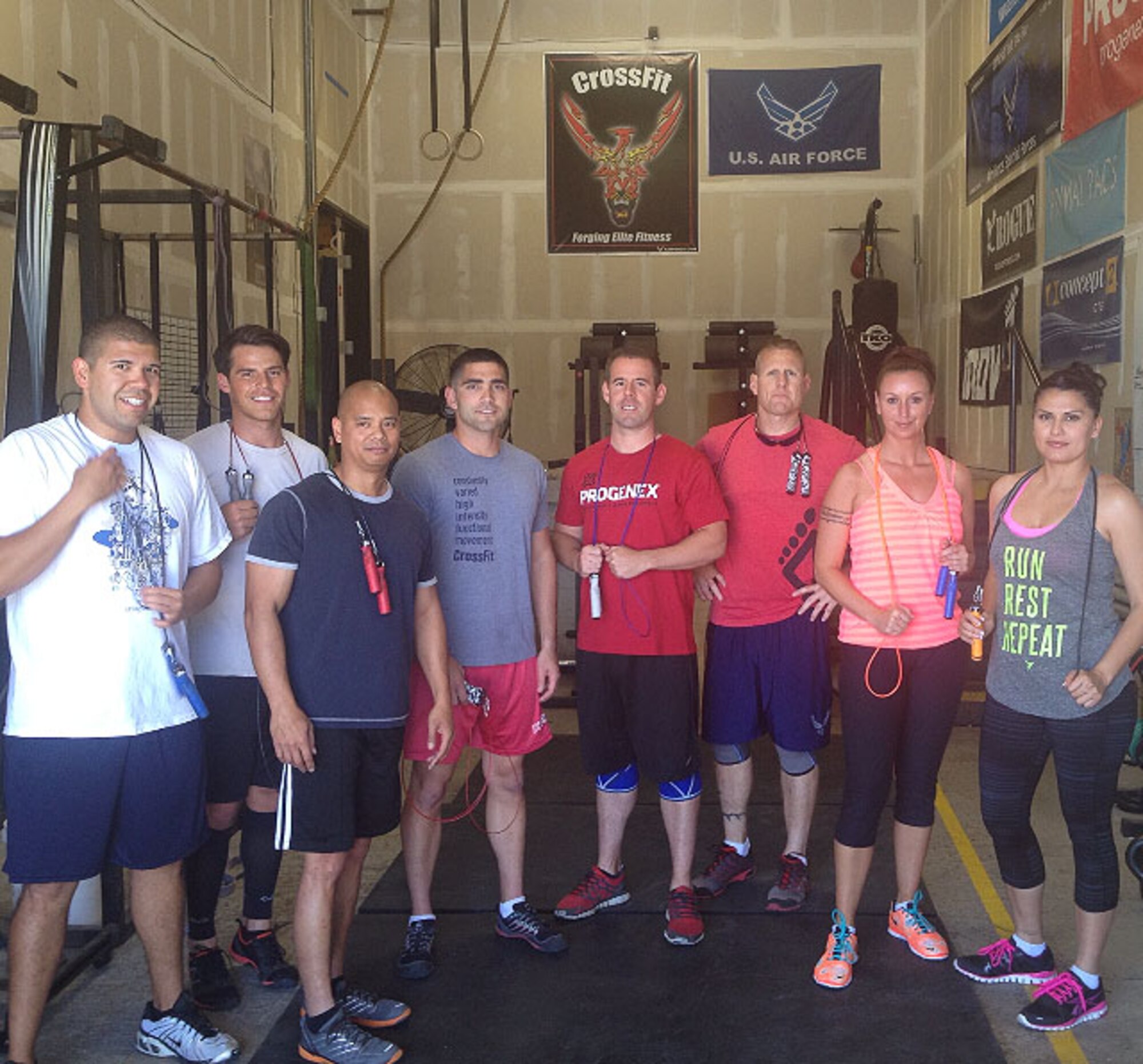 Members of the 364th Recruiting Squadron pose for a photo at CrossFit 364, a recognized military affiliate located in their squadron headquarters. From left are: Staff Sgt. Jeanpierre Grajeda, Dan, Master Sgt. Valentino Rialon, Capt. Samuel Murray, Staff Sgt. Jason Thornhill, Senior Master Sgt. David Burges, Tech. Sgt. Nicky Bobrinitz and Tech. Sgt. Erika Haselhoff. (Courtesy photo/David Parker)

