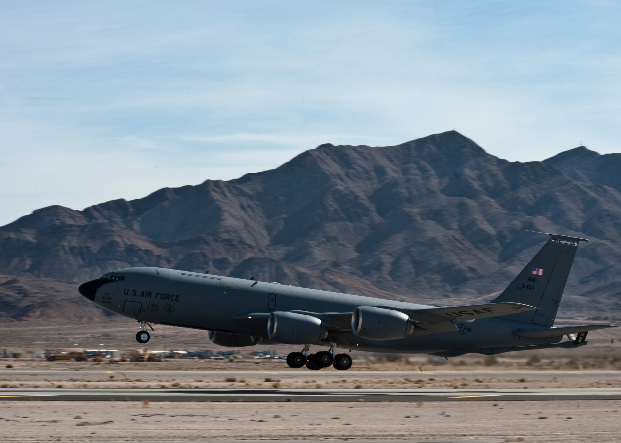 A KC-135 Stratotanker assigned to the 92nd Air Refueling Wing at Fairchild Air Force Base, Wash., takes off during Red Flag 14-1 Jan. 28, 2014, at Nellis Air Force Base, Nev. Red Flag is hosted by the 414th Combat Training Squadron. In a typical Red Flag exercise, friendly blue forces engage hostile red forces in realistic combat situations in air, space and cyberspace. (U.S. Air Force photo by Airman 1st Class Jason Couillard)