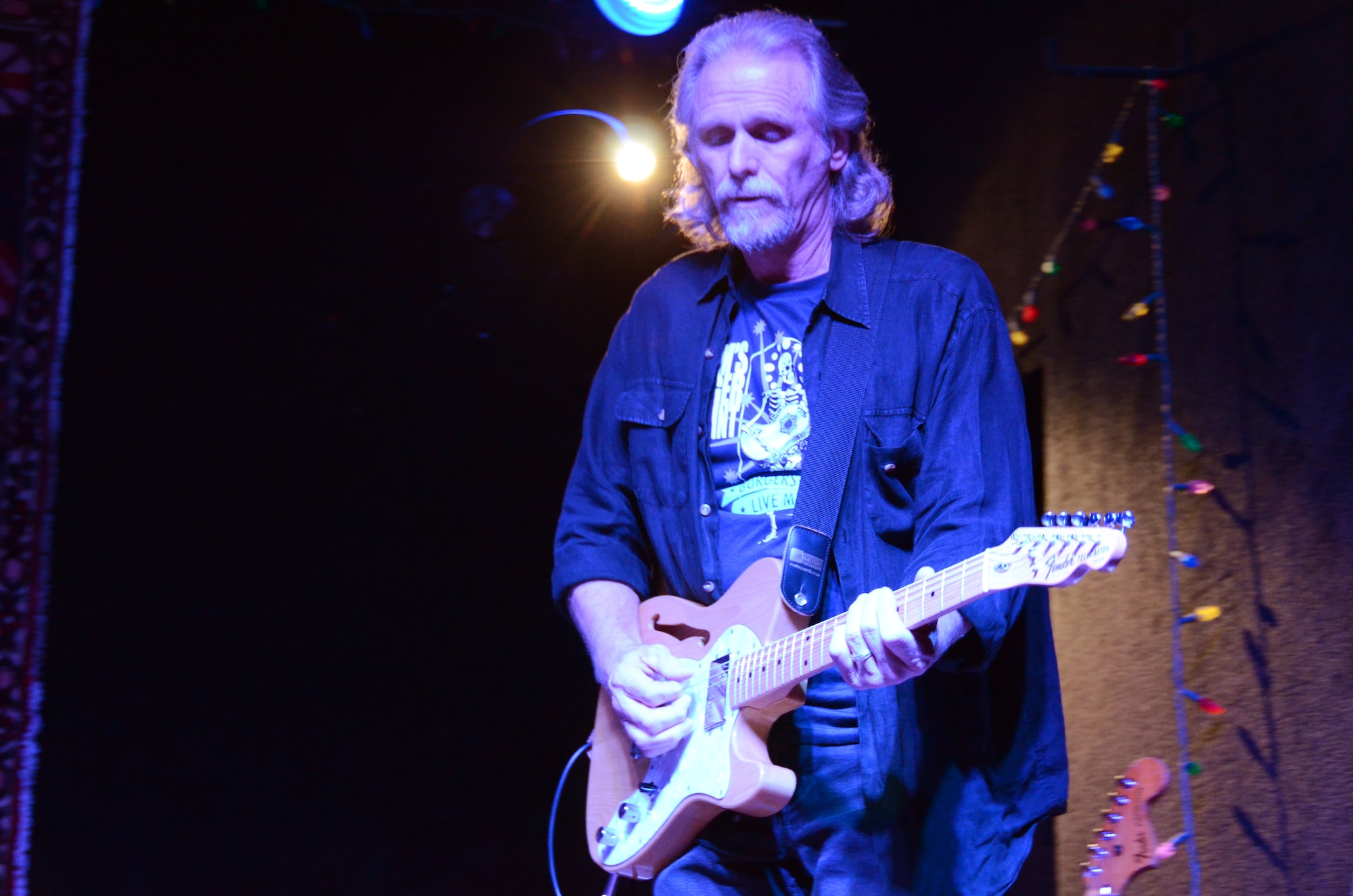 Jimmy Spacek, Air Force Recruiting Service broadcast supervisor, plays the blues at a San Antonio music venue. Spacek retires Jan. 31 after nearly 30 years of civil service. (U.S. Air Force photo/Tech. Sgt. Hillary Stonemetz)