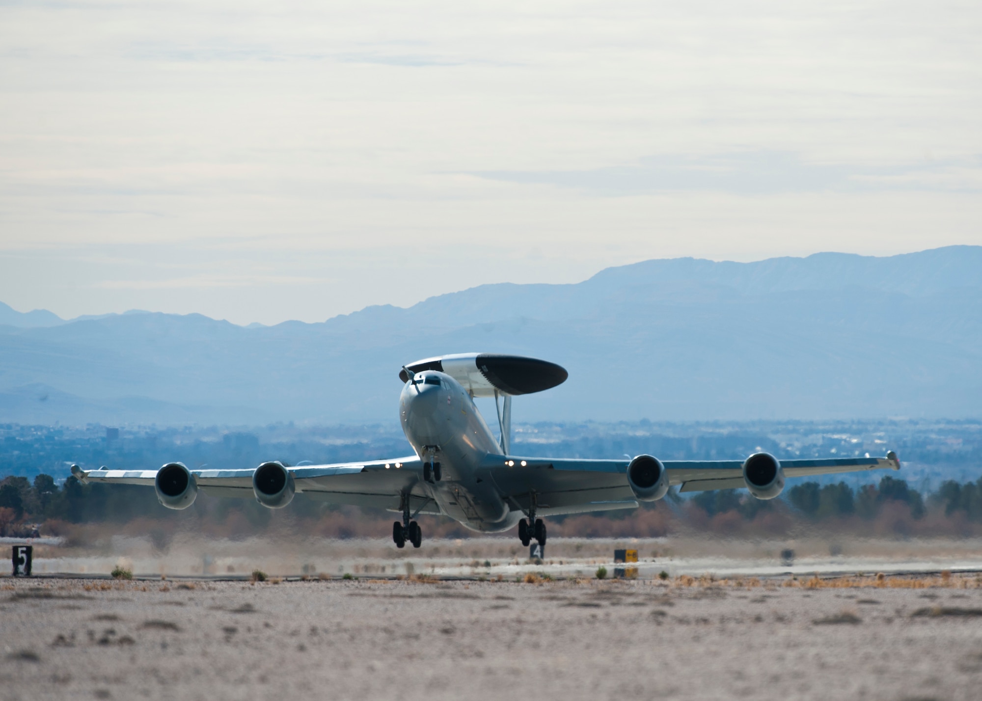A Royal Air Force E-3 Sentry assigned to the VIII Squadron at RAF Station Waddington, United Kingdeom. takes off during Red Flag 14-1 Jan. 28, 2014, at Nellis Air Force Base, Nev. The E-3 Sentry provides situational awareness of friendly, neutral and hostile activity, command and control of an area of responsibility, battle management of theater forces, all-altitude and all-weather surveillance of the battle space, and early warning of enemy during joint, allied and coalition operations. Red Flag 14-1 is an air-to-air combat training exercise designed to increase combat effectiveness and has expanded to incorporate all spectrums of warfare including command and control, real-time intelligence, analysis and exploitation and electronic warfare. (U.S. Air Force photo by Airman 1st Class Thomas Spangler)