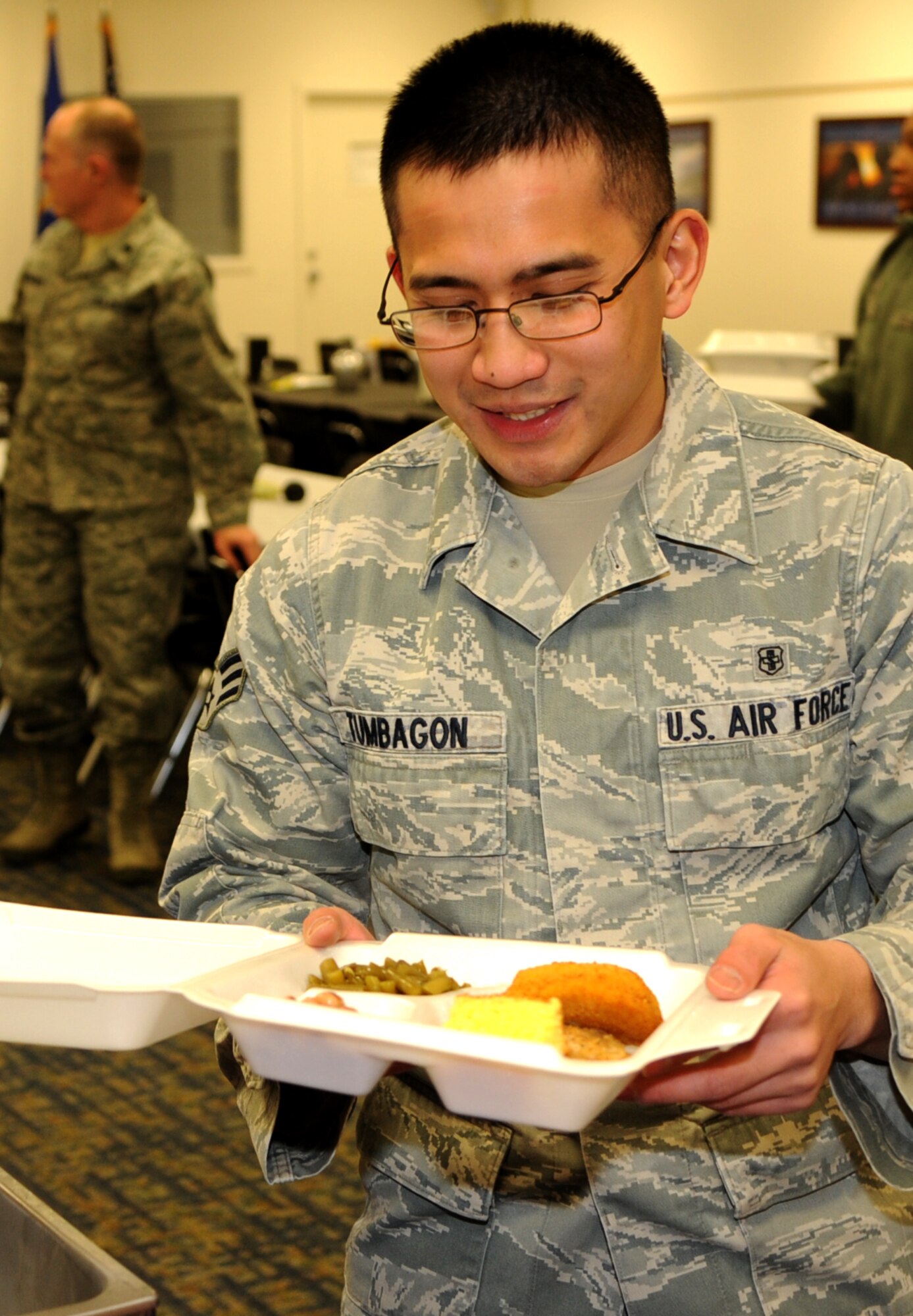 Senior Airman Mark Tumbagon, with the 71st Logistics Readiness Squadron, is one of 168 diners served at the Singles’ International Gourmet Meal Opportunity Jan. 27 in the Community Chapel Activity Center at Vance Air Force Base, Okla. (U.S. Air Force photo/ Senior Airman Frank Casciotta)