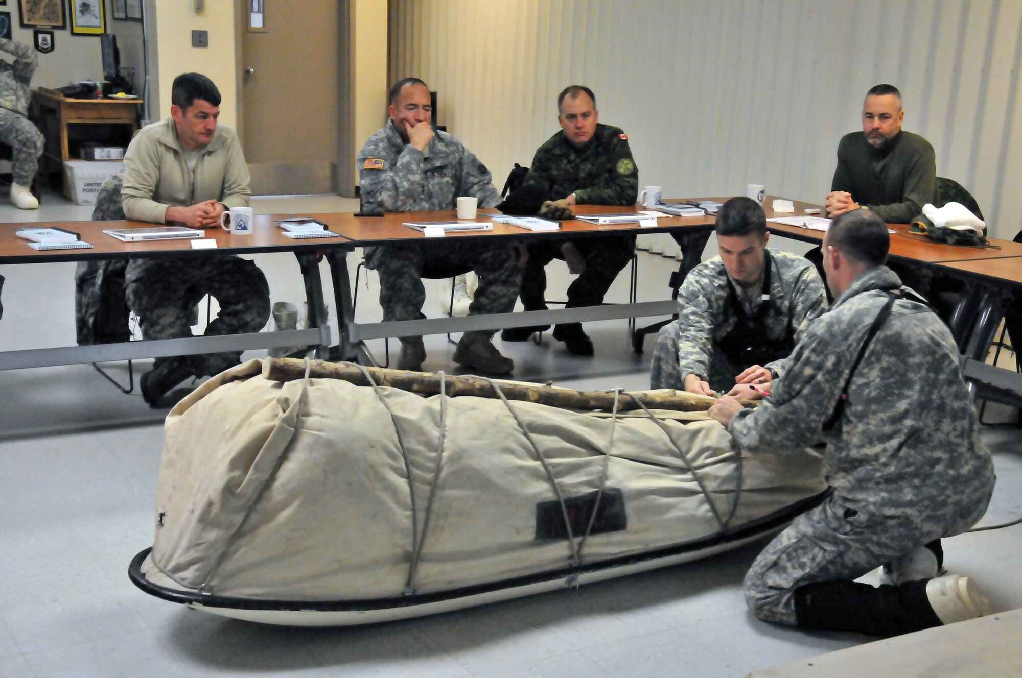 BLACK RAPIDS TRAINING SITE, Alaska— Attendees of an Arctic General Officer/Flag Officer Conference learn Arctic survival gear and resources during a U.S. Army Alaska training class Jan. 10. Alaskan Command/Joint Task Force-Alaska and USARAK hosted a GO/FO Conference Jan. 7-11, which included distinguished guests from the U.S. Air Force, U.S. Army, Alaska National Guard, U.S. Coast Guard and Canadian Forces, to strengthen partnerships, discuss future Arctic challenges and joint capabilities. (U.S. Air Force photo/Tech. Sgt. John Gordinier)