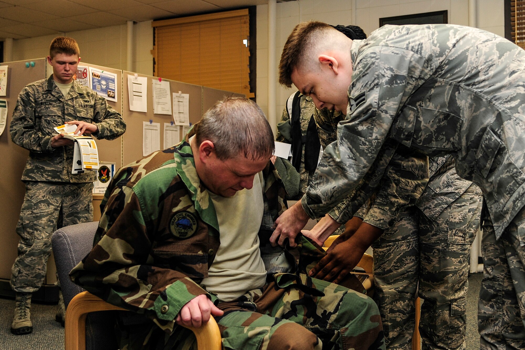 Airman 1st Class Michael Standridge, 354th Comptroller Squadron financial services technician, tends to a simulated injured individual during a Self-Aid Buddy Care scenario as part of an Operation Readiness Exercise Jan. 28, 2014, Eielson Air Force Base, Alaska. Icemen are tested during OREs with various SABC situations and evaluated based on their response. (U.S. Air Force photo by Senior Airman Zachary Perras/Released)