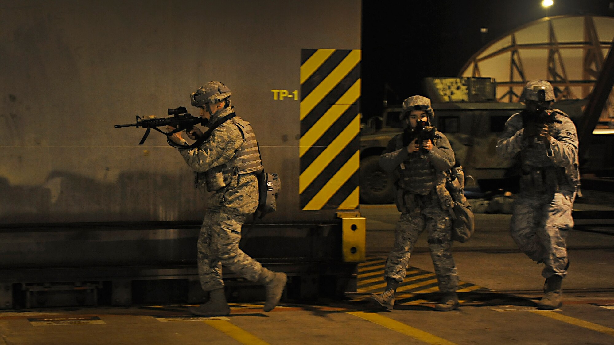 Members from the 31st Security Forces Squadron respond to a training exercise, Jan. 23, 2014, at Aviano Air Base, Italy. During the training exercise, SFS Airmen were challenged to ensure the safety of all base weapons, property and personnel from potential hostile forces. Training is performed to help Airmen hone their skills through readiness. (U.S. Air Force photo/Staff Sgt. Evelyn Chavez)