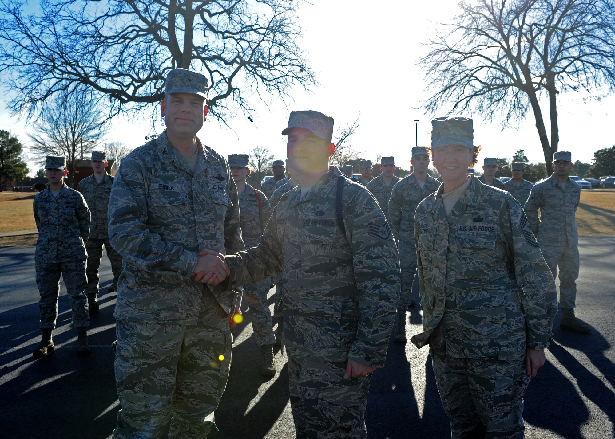 Col. Scott Brewer, 314th Airlift Wing commander, along with Chief Master Sgt. Andrea Gates, 314th AW command chief, congratulate Staff Sgt. Jeremy Farnsworth for his selection as the Combat Airlifter of the Week Jan. 28, 2014, at Little Rock Air Force Base, Ark. Farnsworth, a native of Mesquite, Nev., volunteered to become a military training leader and mentors three students at Jacksonville Middle School. (U.S. Air Force photo by Airman 1st Class Scott Poe)