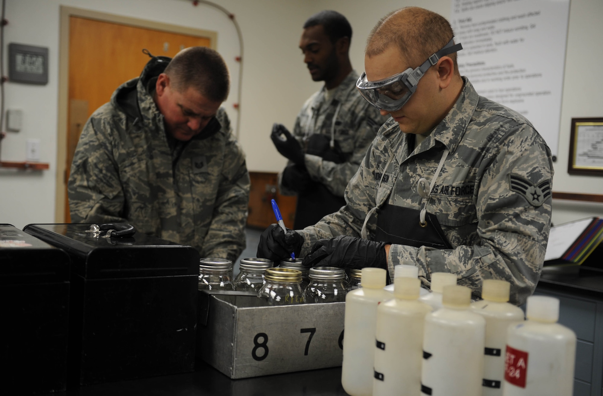 Senior Airman Dylan Johnson, a 19th Logistics Readiness Squadron fuels lab technician, prepares fuel sample bottles for a customer Jan. 16, 2014, at Little Rock Air Force Base, Ark. Jet fuel is sampled and tested daily at Little Rock AFB. (U.S. Air Force photo by Staff Sgt. Jessica Condit)