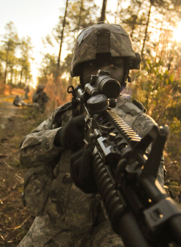 A U.S. Air Force Airman of the 125th Fighter Wing Security Forces Squadron performs a Dismounted Patrol Exercise at Jacksonville IAP, Jacksonville, Fla., March 16, 2013. During an in theatre Dismounted Patrol, Security Forces members seek out active threats around the base perimeter.