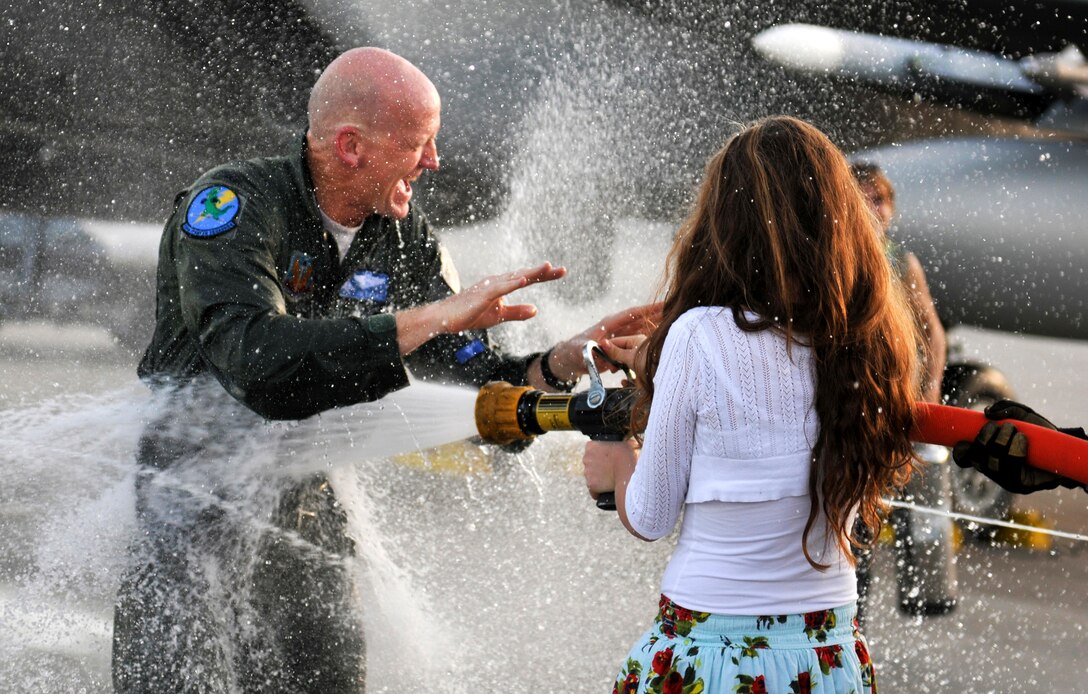 Col. James Eifert, Commander 125th Fighter Wing is showered with water by his daughter after his final flight in the F-15 Eagle, January 12, 2013. Col. Eifert has been selected as Florida's newest Assistant Adjutant General for the Florida Air National Guard.