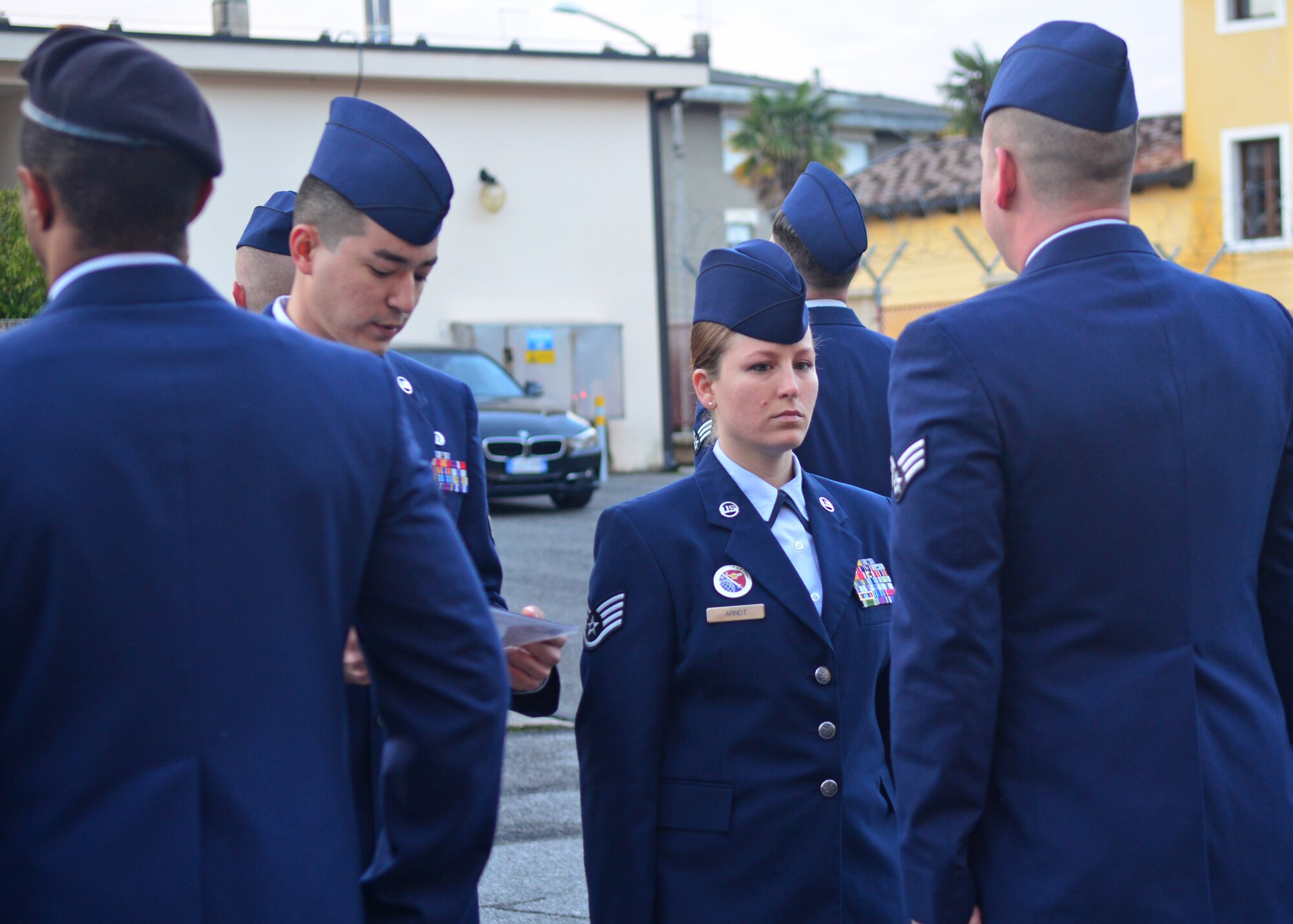 Staff Sgt. Amanda Arndt, 31st Force Support Squadron Airman Leadership School performs service dress inspections, Jan. 21, 2014, at Aviano Air Base, Italy. At the end of the course Airmen take a variety of tests including a summative test and marching and drill evaluation to determine their eligibility to graduate. (U.S. Air Force photo/Senior Airman Briana Jones)
