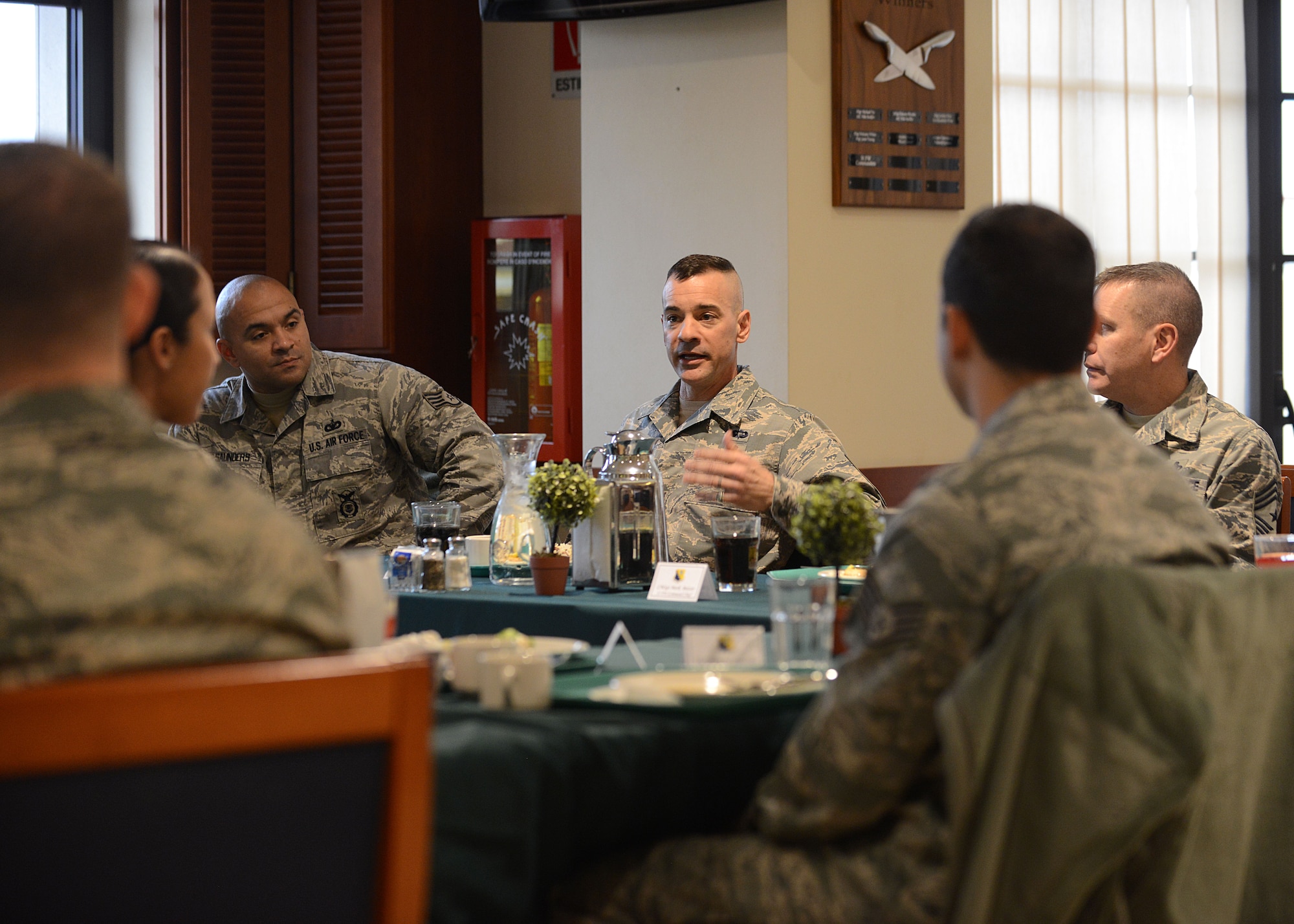 Chief Master Sgt. Mark Marson, Third Air Force command chief, speaks to NCOs during a lunch, Jan. 24, 2014, at Aviano Air Base, Italy. Throughout the day, the 3rd AF top enlisted member met with Aviano NCOs and Senior NCOs, an Airman Leadership School class and spoke during a chief recognition ceremony. (U.S. Air Force photo/Airman 1st Class Ryan Conroy) 