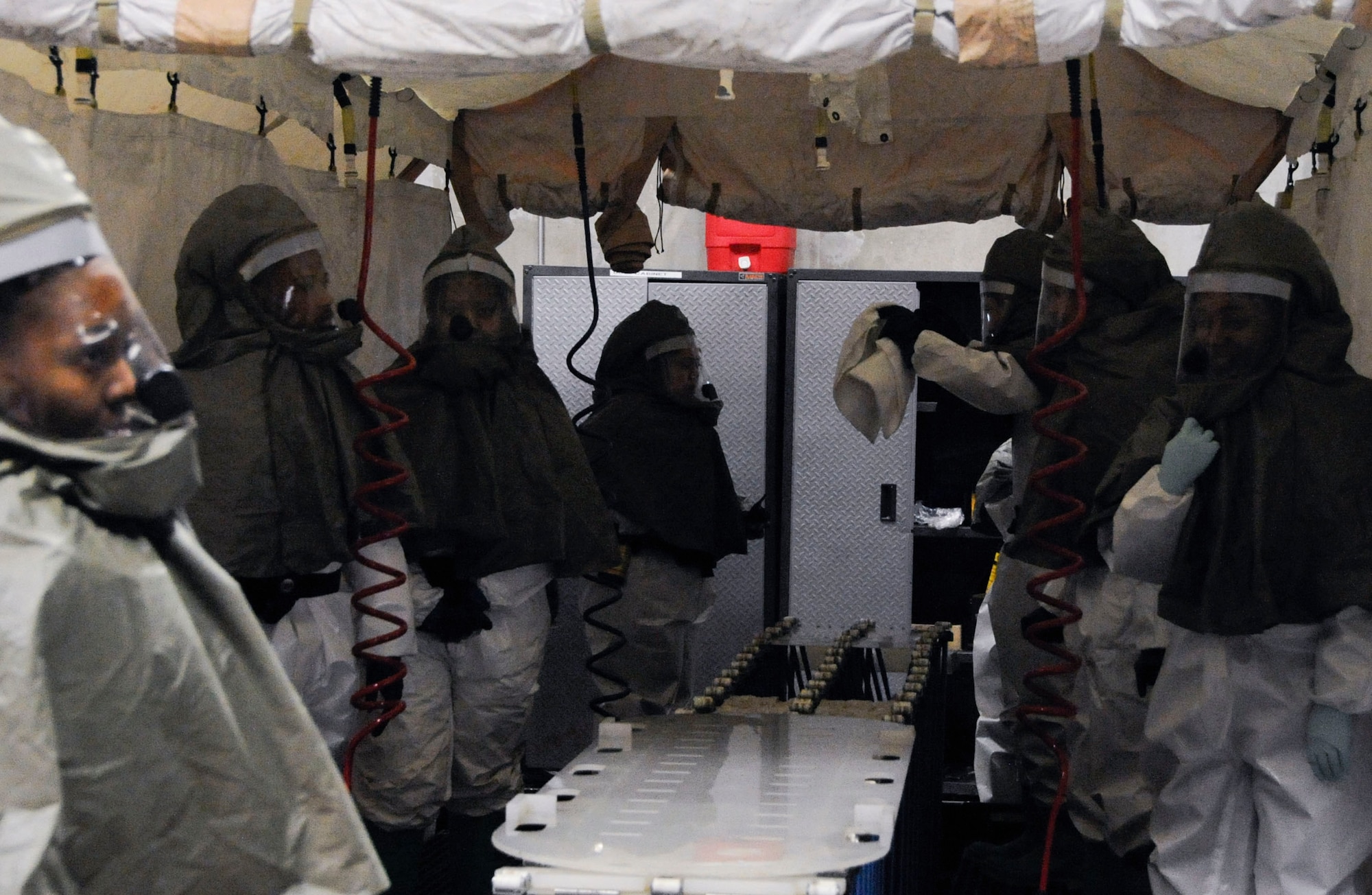 Airmen from the 35th Medical Group’s decontamination team prepares for an incoming patient during an operational readiness exercise at Misawa Air Base, Japan, Jan. 28, 2014. The team assembled after they were notified a patient was exposed to chemicals during a simulated attack during the ORE. (U.S. Air Force photo/Airman 1st Class Patrick S. Ciccarone)