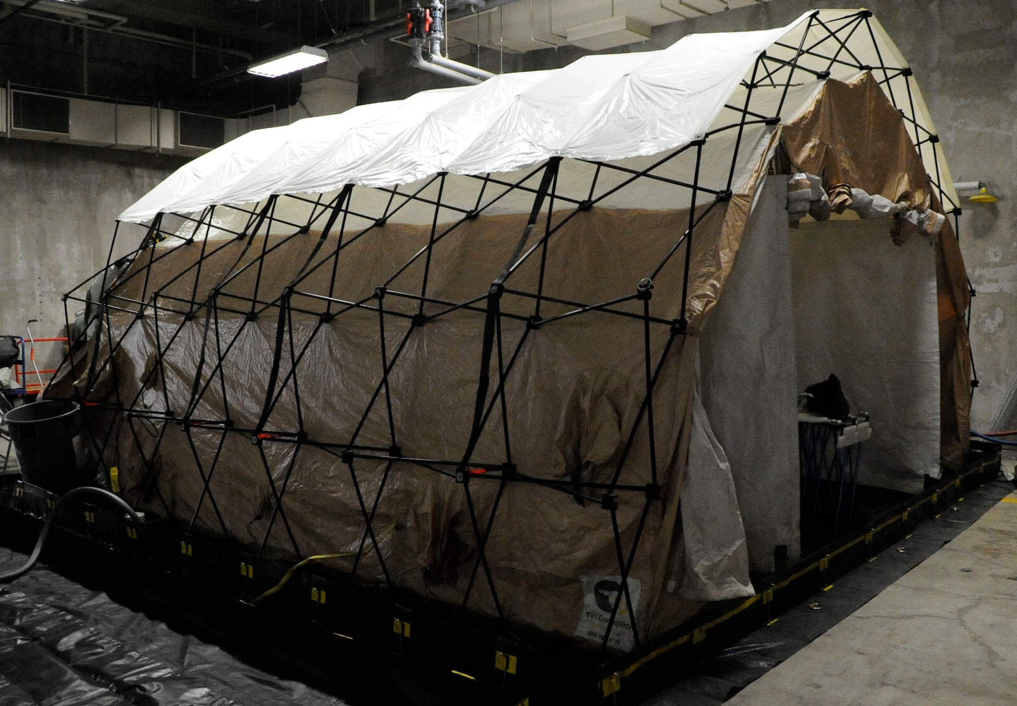 Decontamination tents are used by Airmen from the 35th Medical Group to cleanse patients who were exposed to chemicals during the operational readiness exercise at Misawa Air Base, Japan, Jan. 28, 2014. Patients are guided through the tent and scrubbed and sprayed until they are free of chemical residue. (U.S. Air Force photo/Airman 1st Class Patrick S. Ciccarone)