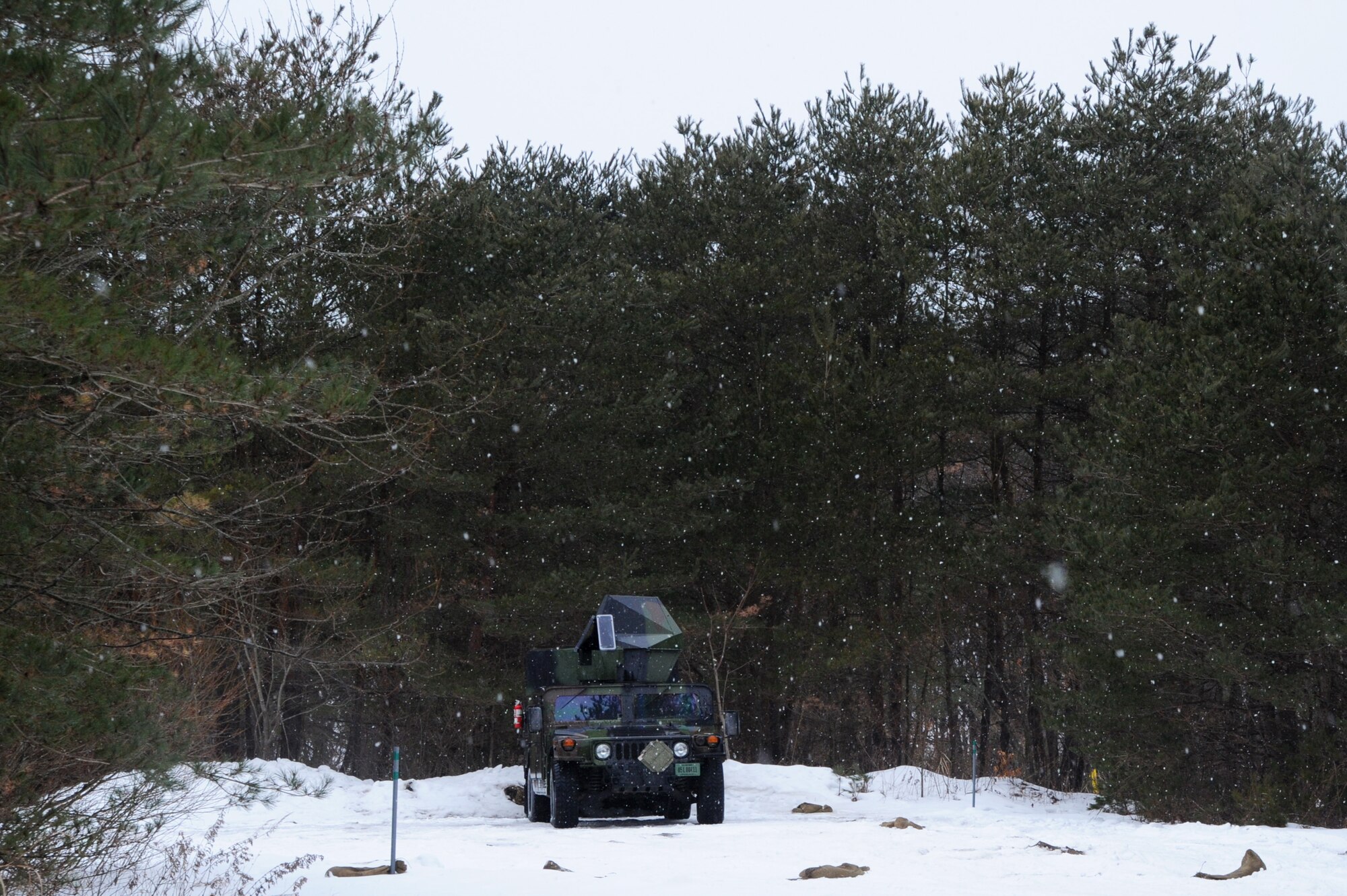 Staged on a Misawa Air Base hill-top, the 35th Civil Engineer Squadron Explosive Ordnance Disposal team waits for a simulated attack before checking for unexploded ordnance around the base during an operational readiness exercise, Jan. 28, 2014. The base EOD team responds to all notifications of UXOs, but has predetermined routes to follow in case some aren't discovered. (U.S. Air Force photo/Tech. Sgt. April Quintanilla)