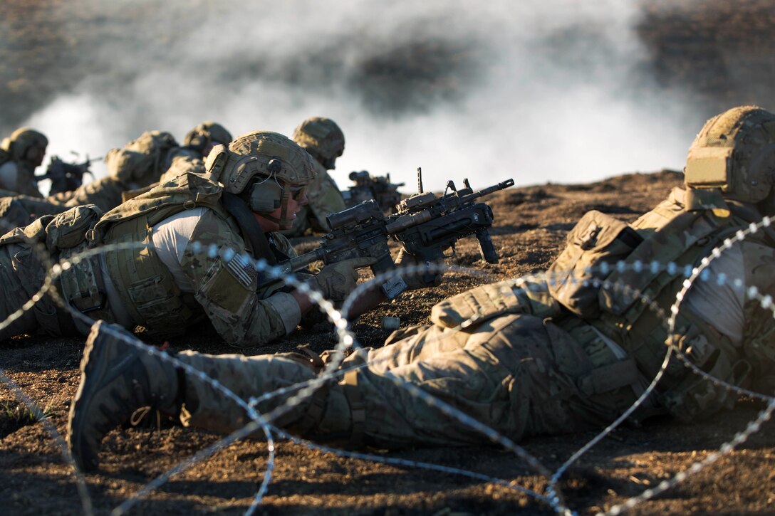 Army Rangers prepare to lay down suppressive fire during live-fire training on Fort Hunter Liggett, Calif., Jan. 23, 2014.