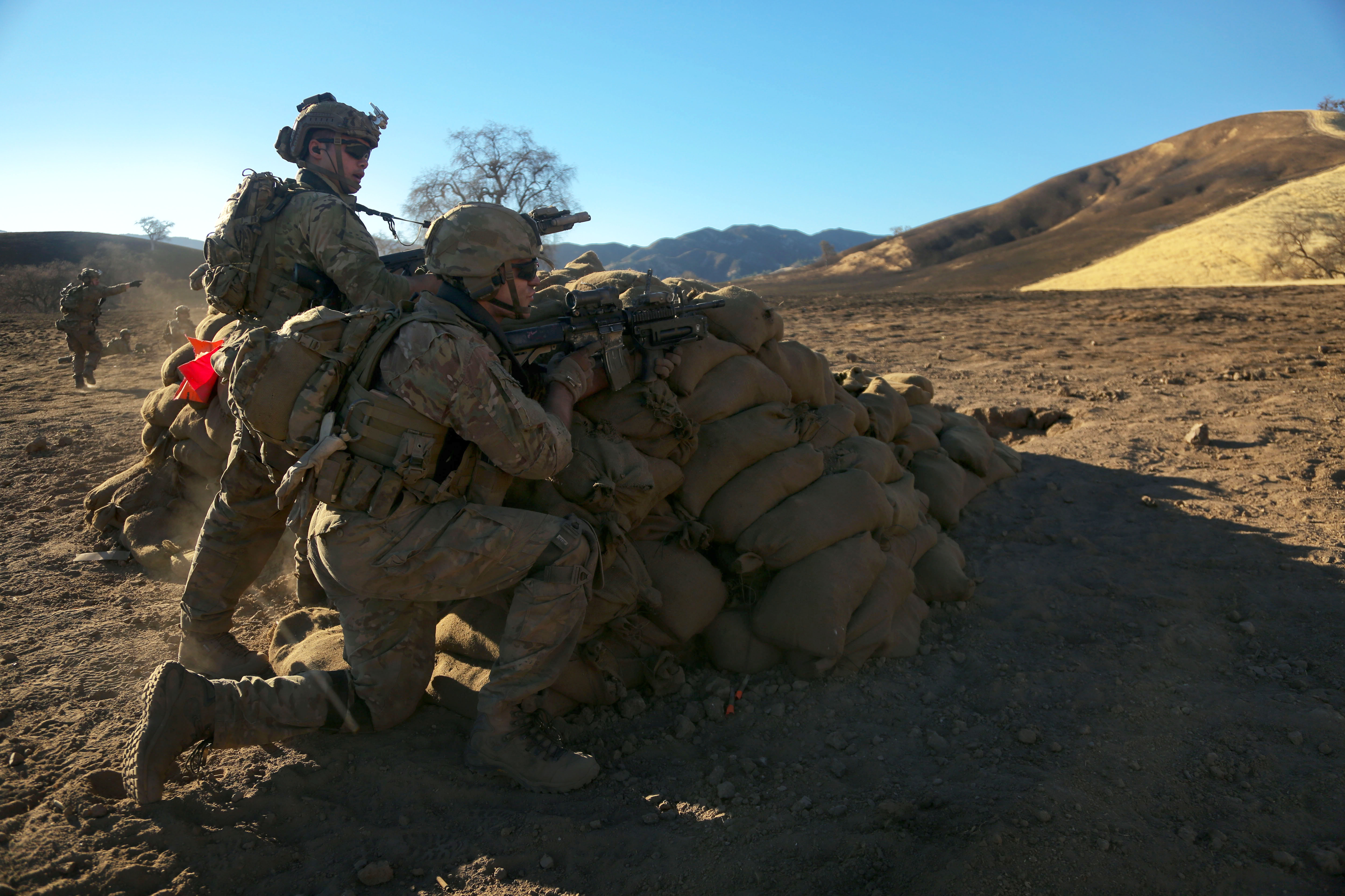 Army Rangers prepare to advance onto their objective during Task Force ...
