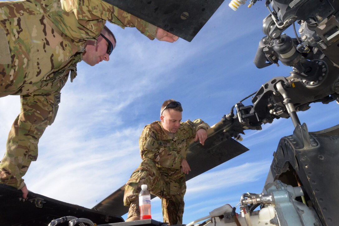 U.S. Army Chief Warrant Officers 2 Jeff Sliger, left, and Taylor Galvin ...