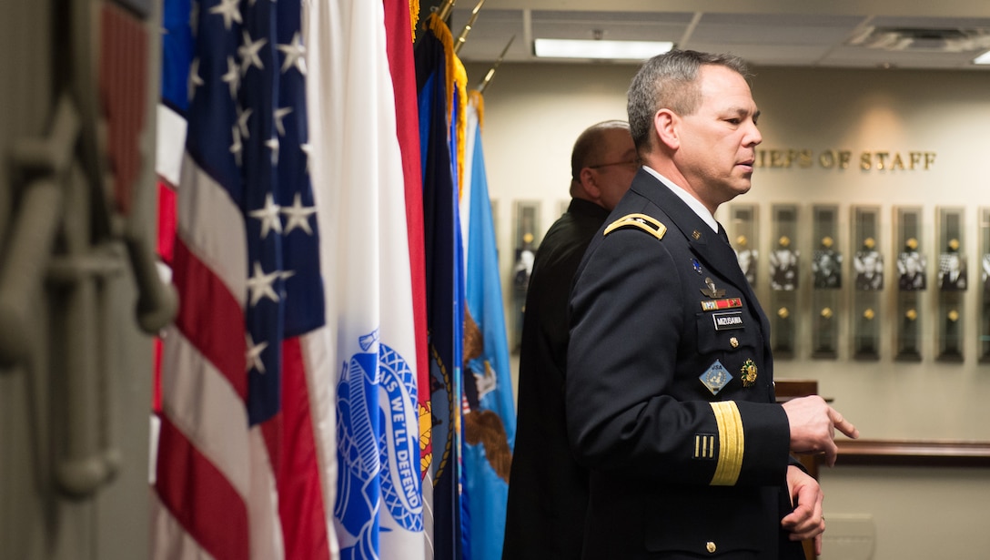Army Maj. Gen. Bert Mizusawa speaks during a ceremony for retired Army Pfc. Mark A. Deville at the Pentagon, Jan. 28, 2014. 