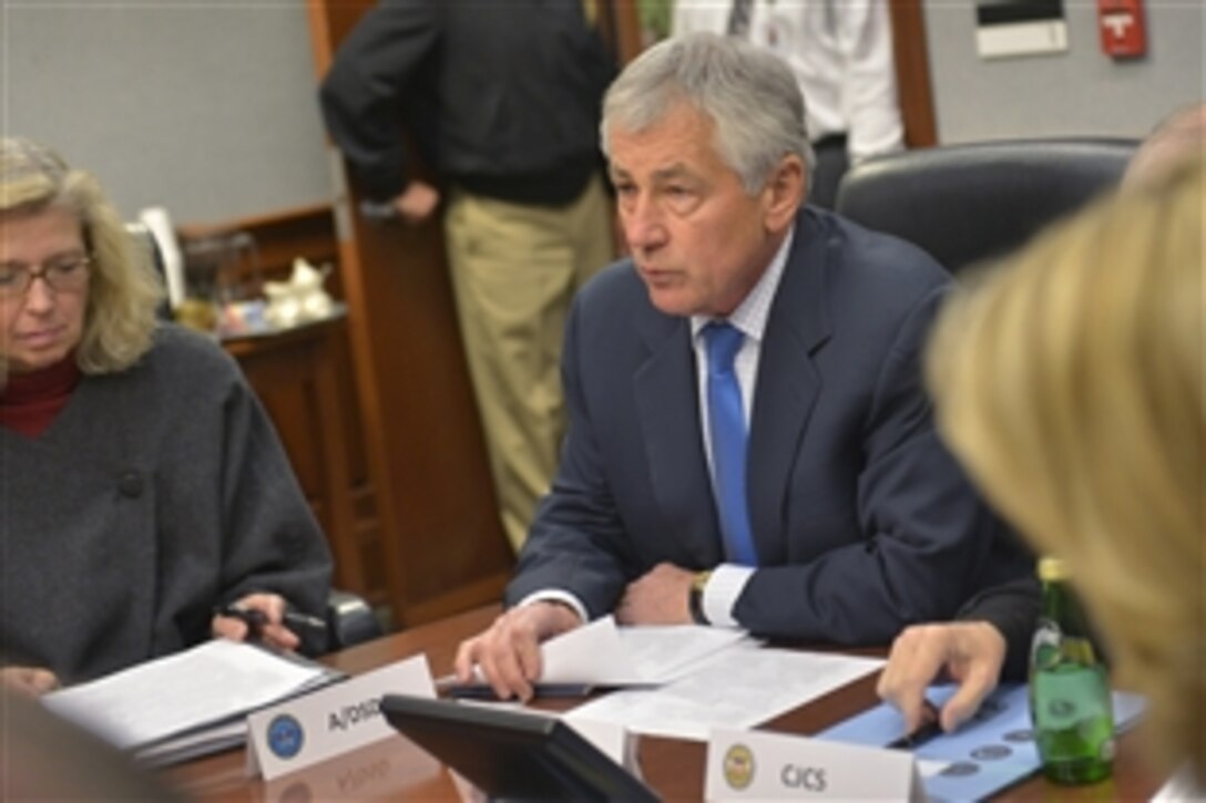 Defense Secretary Chuck Hagel, center, meets with key defense stakeholders in the nuclear enterprise at the Pentagon, Jan. 29, 2014. Hagel convened the meeting to address recent personnel challenges in the nuclear force. Service secretaries, chiefs and commanders responsible for carrying out the nuclear mission participated in the meeting. (Content on printed documents has been digitally altered to protect sensitive information.)