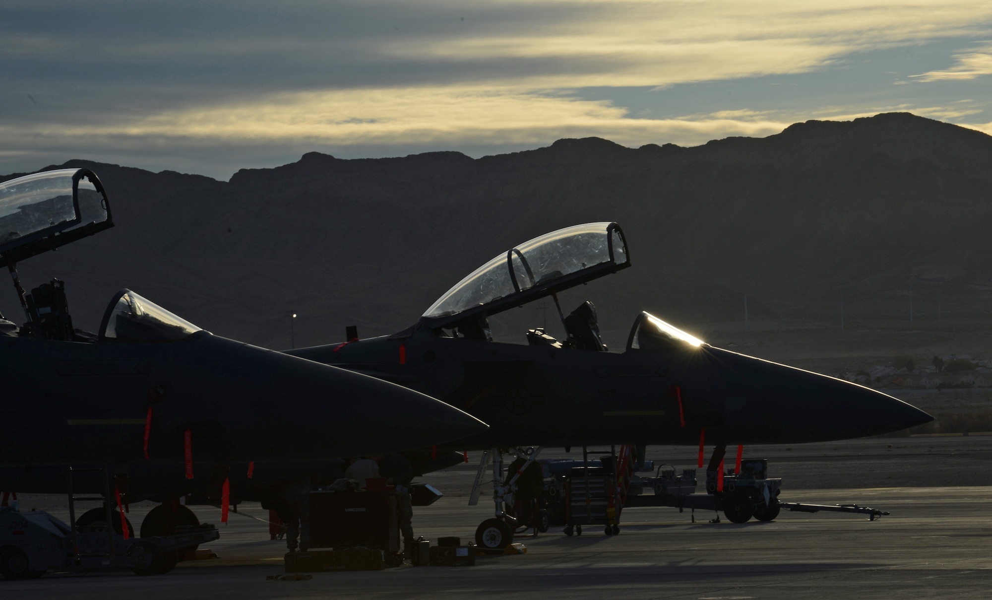 F-15E Strike Eagles from Mountain Home Air Force Base, Idaho, are parked on the flight line Jan. 28, 2014, at Nellis Air Force Base, Nev. Twelve aircraft along with more than 150 personnel are currently on temporary duty assignment at Nellis AFB, while participating in the multinational combat exercise Red Flag 14-1. (U.S. Air Force photo/Senior Airman Benjamin Sutton) 