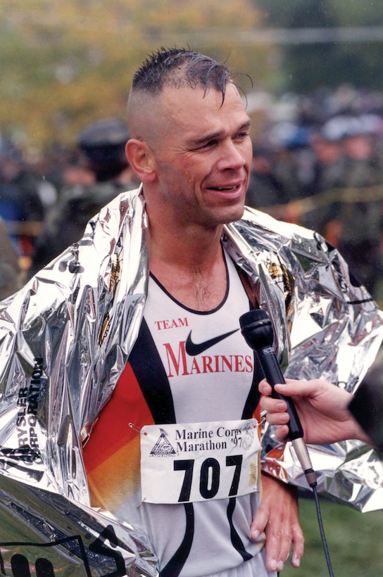 Bret Schmidt answers questions after the 1997 Marine Corps Marathon. Schmidt is the operations manager for the Marine Corps Marathon.