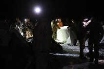 Service members with Ragnarok Company, 2nd Supply Battalion, 2nd Marine Logistics Group assist 2nd Battalion, 2nd Marine Regiment, 2nd Marine Division set up camp aboard the Mountain Warfare Training Center in Bridgeport, Calif., Jan. 18, 2014. The company’s mission is to support 2nd Bn., 2nd Marines during the upcoming NATO exercise Cold Response 2014.