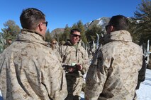 Sergeant James J. Cassidy (center), a Philadelphia, Penn., native and platoon sergeant with Ragnarok Company, 2nd Supply Battalion, 2nd Marine Logistics Group, discusses casualty evacuation procedures with his fireteam aboard the Mountain Warfare Training Center in Bridgeport, Calif., Jan. 22, 2014. Knowing and understanding the steps of casualty evacuations is a vital part of operating in especially hazardous environments. 