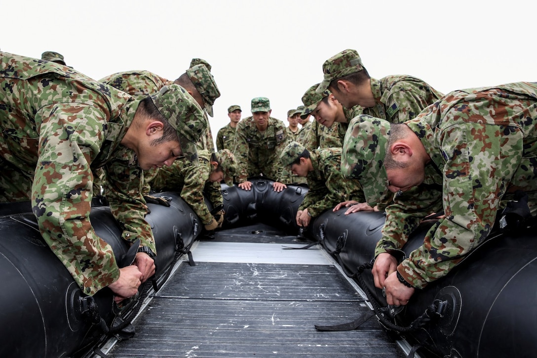 Soldiers with the Japan Ground Self-Defense Force practice rigging rope on a combat rubber reconnaissance craft while conducting Helo Cast training during Exercise Iron Fist 2014 aboard Camp Pendleton, Calif., Jan. 24, 2014. Iron Fist is an amphibious exercise that brings together Marines and sailors from the 15th Marine Expeditionary Unit, other I Marine Expeditionary Force units, and soldiers from the JGSDF, to promote military interoperability and hone individual and small-unit skills through challenging, complex and realistic training. (U.S. Marine Corps photo by Cpl. Emmanuel Ramos/Released)