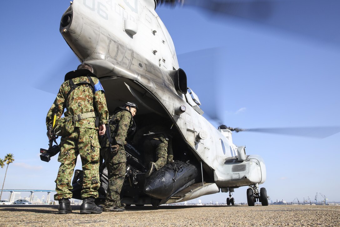 Soldiers with the Japan Ground Self-Defense Force load and fasten a combat rubber reconnaissance craft using the “Soft Duck” method while conducting Helo Cast training during Exercise Iron Fist 2014 aboard Naval Amphibious Base Coronado, Calif., Jan. 27, 2014. Iron Fist is an amphibious exercise that brings together Marines and sailors from the 15th Marine Expeditionary Unit, other I Marine Expeditionary Force units, and soldiers from the JGSDF, to promote military interoperability and hone individual and small-unit skills through challenging, complex and realistic training. (U.S. Marine Corps photo by Cpl. Emmanuel Ramos/Released)