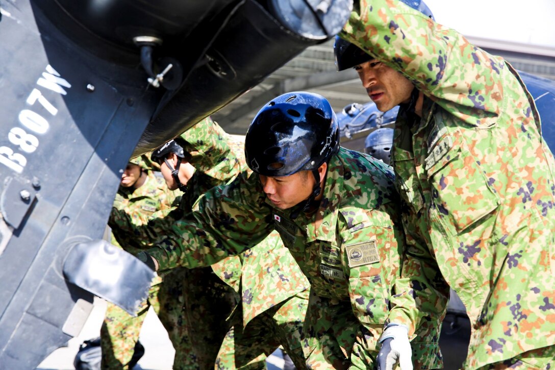 Soldiers with the Japan Ground Self-Defense Force conduct a final inspection on a Zodiac boat before departing on a navigation drill during Exercise Iron Fist 2014 aboard Naval Amphibious Base Coronado, Calif., Jan. 27, 2014. Iron Fist is an amphibious exercise that brings together Marines and sailors from the 15th Marine Expeditionary Unit, other I Marine Expeditionary Force units, and soldiers from the JGSDF, to promote military interoperability and hone individual and small-unit skills through challenging, complex and realistic training. (U.S. Marine Corps photo by Lance Cpl. Ricardo Hurtado/Released)