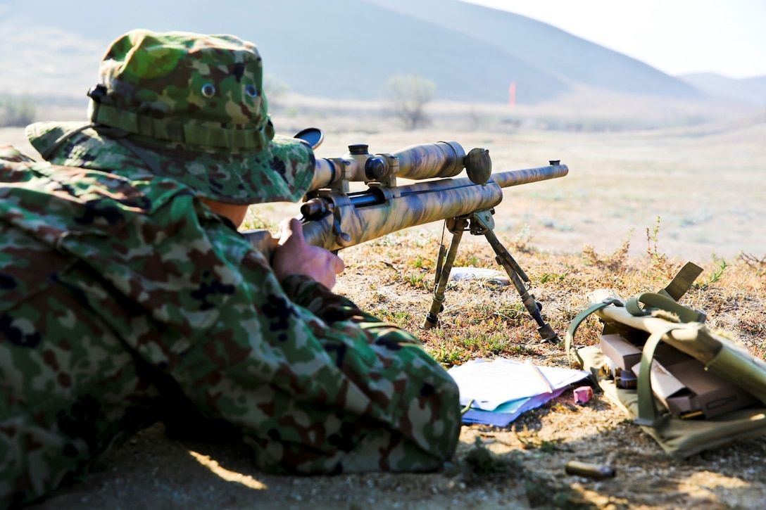 A soldier from the Japan Ground Self-Defense Force performs shooting drills while conducting scout sniper training during Exercise Iron Fist 2014 aboard Camp Pendleton, Calif., Jan. 29, 2014. Iron Fist is an amphibious exercise that brings together Marines and sailors from the 15th Marine Expeditionary Unit, other I Marine Expeditionary Force units, and soldiers from the JGSDF, to promote military interoperability and hone individual and small-unit skills through challenging, complex and realistic training. (U.S. Marine Corps photo by Lance Cpl. Ricardo Hurtado/Released)