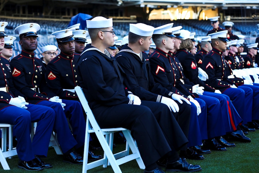 Marines and Sailors from Camp Pendleton, Marine Corps Air Station Miramar and Marine Corps Recruit Depot San Diego, watch a video honoring Jerry Coleman, during a memorial service held at Petco Park in San Diego, Jan. 18. Coleman, a former Major League Baseball player and announcer, served in two wars as a Marine pilot.