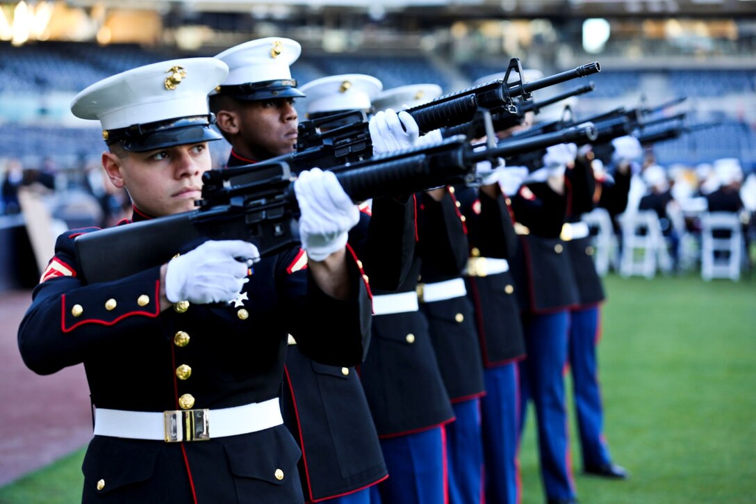 Marines from Marine Corps Air Station Miramar render a 21 gun-salute during a memorial service to honor Jerry Coleman in San Diego, Jan. 18. Coleman, a former Major League Baseball player and announcer, served in two wars as a Marine pilot.