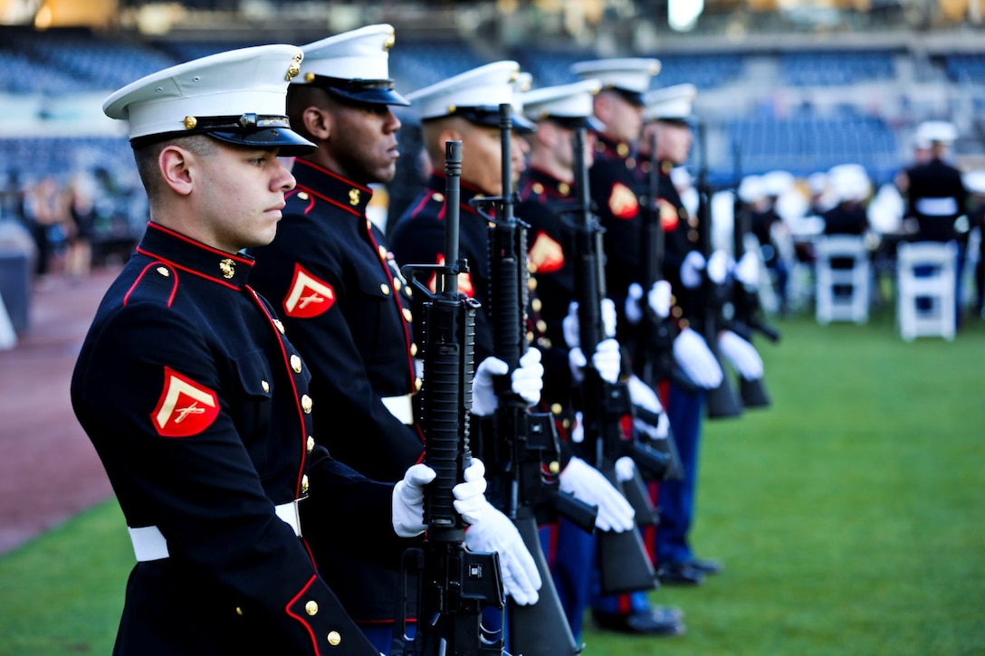 Marines from Marine Corps Air Station Miramar present arms while TAPS plays after a 21 gun-salute during a memorial service to honor Jerry Coleman in San Diego, Jan. 18. Coleman, a former Major League Baseball player and announcer, served in two wars as a Marine pilot.