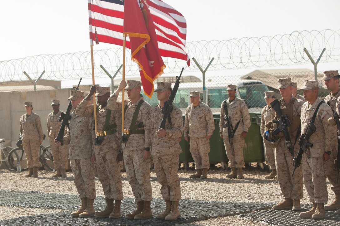 Marines with Combat Logistics Battalion 7 present organizational colors during a transfer of authority ceremony aboard Camp Leatherneck, Afghanistan, Jan. 26, 2014. The battalion replaced CLB-6 as the logistics combat element for Regional Command (Southwest) and will provide logistical support to units operating in Helmand province. (U.S. Marine Corps photo by Cpl. Cody Haas/ Released)
