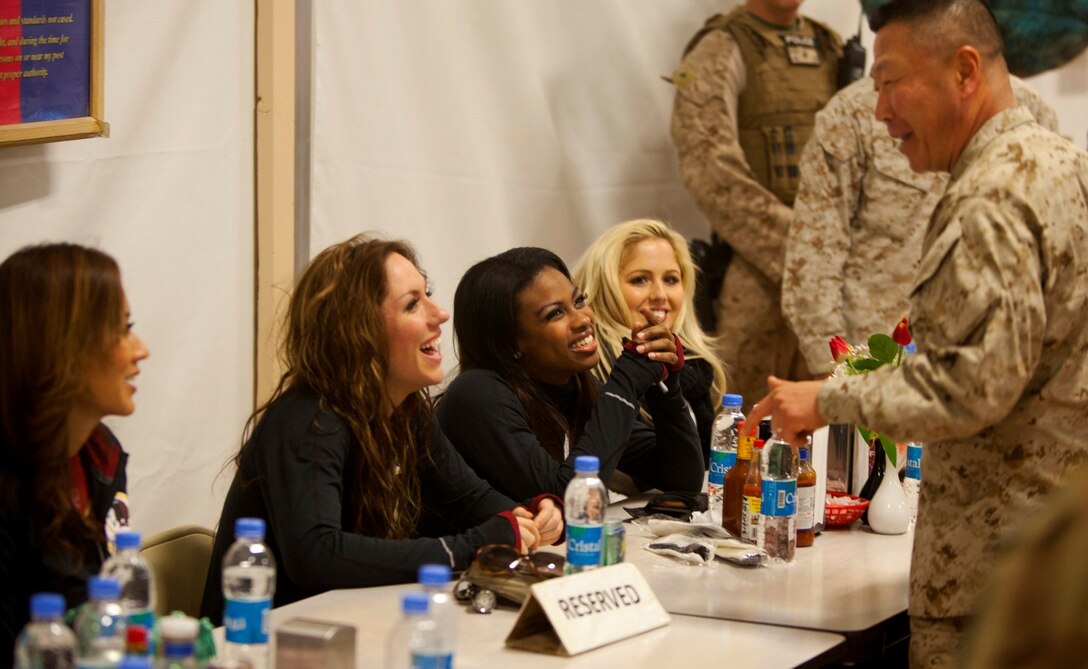eneral, I Marine Expeditionary Force (FWD), while eating at a dining facility during a visit to support the troops aboard Camp Leatherneck, Afghanistan, Jan. 28, 2014. To show their appreciation for those serving in support of Operation Enduring Freedom, they personally autographed several calendars starring the cheerleaders and posed for photographs with service members. (U.S. Marine Corps photo by Cpl. Cody Haas/ released)