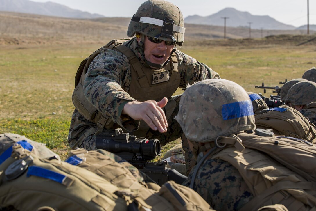 Sgt. Jason St. John gives instruction to a student during a live fire exercise on range 218A in the 53-area of Camp Pendleton on Jan. 28. The students are training to be basically qualified 0331 machine gunners. St. John is a combat instructor. 

Infantry Training Battalion trains all infantry, entry-level Marines in the infantry skills essential to operating combat environment. Infantry Training Battalion is a 52-day training course that transforms the raw Marine into an infantryman who can fight, survive, and win in a combat situation. 