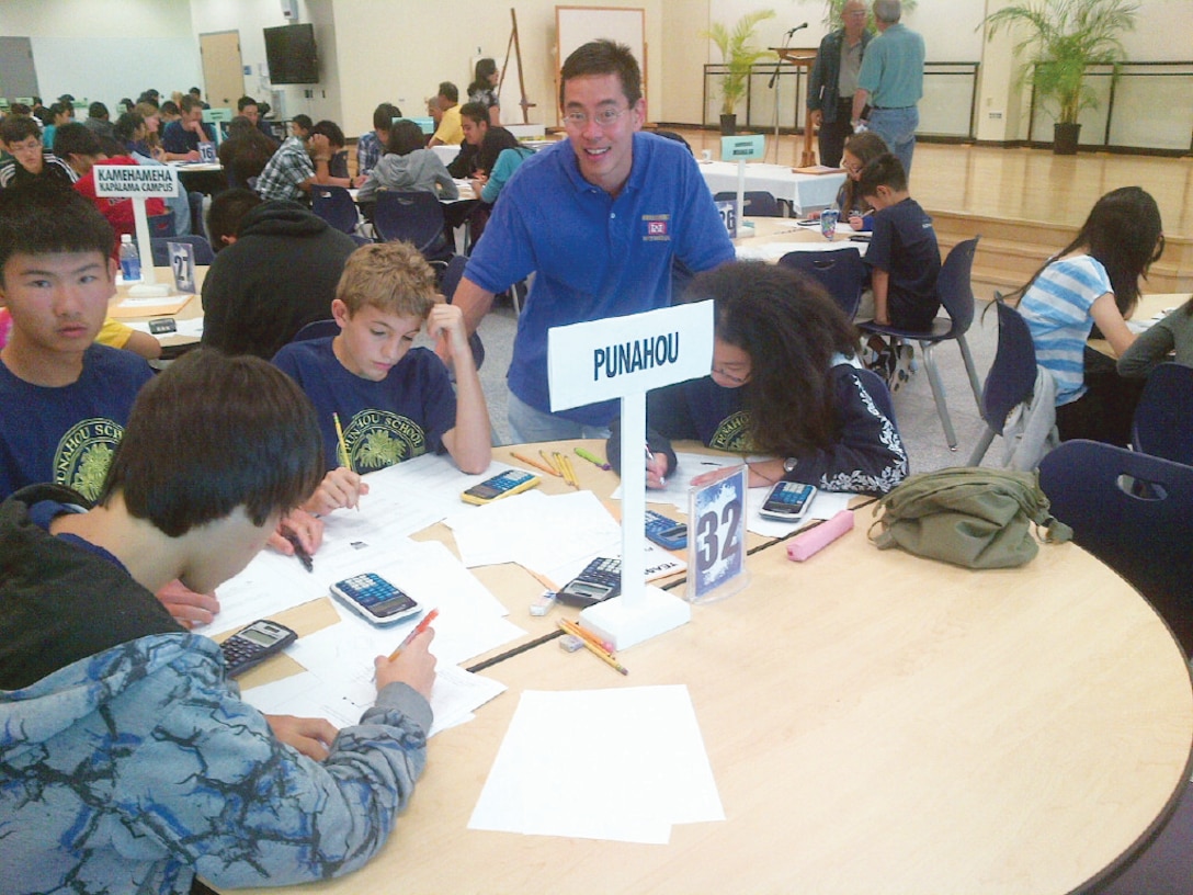 Mechanical Engineer Michael Onuma (standing) proctors Punahou School students competing at the 2013 MATHCOUNTS Oahu county competition held in February at Kamehameha Schools. Sixteen District engineers and staff volunteered their services for the 30th annual competition as moderators, proctors and scorers. Sixth, seventh and eighth graders from 36 Oahu public and private schools participated in the competition. MATHCOUNTS is sponsored by the National Society of Professional Engineers at the state and local levels to emphasize the importance of mathematical skills in the development of future technology and encourage students to excel in these areas. The U.S. Army Corps of Engineers recognizes the critical role that Science, Technology, Engineering and Mathematics (STEM) education plays in enabling the U.S. to remain the economic and technological leaders of the global marketplace, and enabling the Department of Defense and Army in the security of our Nation. 