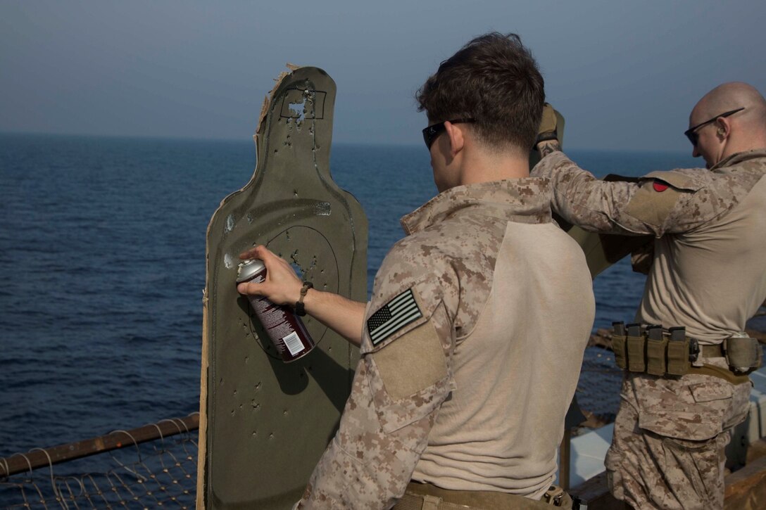 ARABIAN GULF (Jan. 28, 2014) – U.S. Marines assigned to Force Reconnaissance platoon, 13th Marine Expeditionary Unit, repair targets during a deck shoot on the flight deck aboard USS New Orleans (LPD 18) Jan. 28, 2014. The 13th MEU is deployed with the Boxer Amphibious Ready Group as a theater reserve and crisis response force throughout the U.S. 5th Fleet area of responsibility. (U.S. Marine Corps photo by Sgt. Ammon W. Carter 13th Marine Expeditionary Unit Combat Camera/Released)