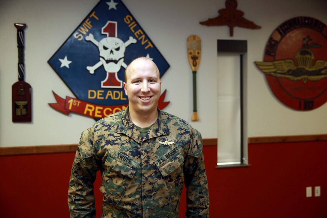 Sergeant Charles Swope, assistant team leader, 1st Reconnaissance Battalion, earned his Masters of Business Administration, completing part of his degree while on his two deployments to Afghanistan. Swope, a native of Coral Springs, Fla., said the hardest part of completing his course load was dealing with the stress of being in a combat zone while still performing in his classes. He will attend his commencement ceremony May 2014. (U.S. Marine Corps photo by Cpl. James Gulliver/Released)