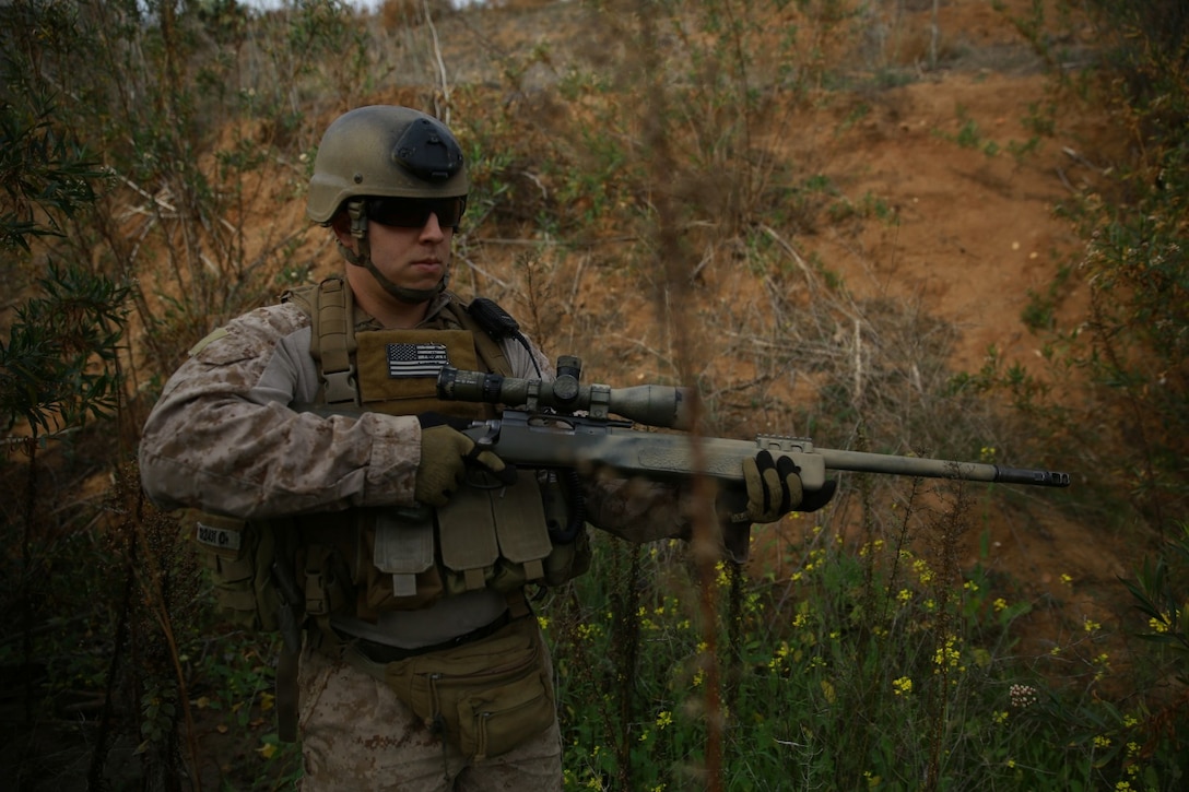 Sergeant Charles Swope, team leader, 1st Reconnaissance Battalion, performs a security patrol during a training exercise at Marine Corps Base Camp Pendleton, Calif., Jan. 9, 2014. Swope, a native of Coral Springs, Fla., earned his Masters of Business Administration, completing part of his degree during his two deployments to Afghanistan. There were times when he would take academic tests in a classroom only hours after engaging enemy forces. He will attend his commencement ceremony May 2014. (U.S. Marine Corps photo by Cpl. James Gulliver/Released)