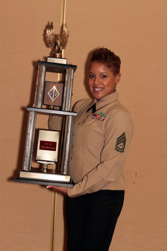 Gunnery Sgt. Shavon N. Nicholson, 11th Marine Regiment career planner, 1st Marine Division, received the Guadalcanal Trophy for outstanding achievement in 2013 on behalf of her team of career planners during the 1st Marine Division Annual Career Planning Awards Luncheon at Marine Corps Base Camp Pendleton, Calif., Jan. 27, 2014. Nicholson, a native of Axton, Va., supervises career planners who assist in serving more than 25,000 combat-ready Marines and Sailors throughout 1st Marine Division. Career planners are responsible for interviewing Marines several times during their careers and assisting them in reenlisting, transitioning successfully to civilian life or pursuing higher education.
 (U.S. Marine Corps photo by Sgt. Jacob H. Harrer / released)
