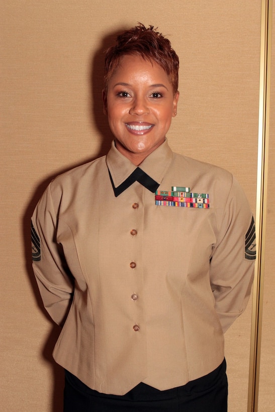 Gunnery Sgt. Shavon N. Nicholson, 11th Marine Regiment career planner, 1st Marine Division, received the Guadalcanal Trophy for outstanding achievement in 2013 on behalf of her team of career planners during the 1st Marine Division Annual Career Planning Awards Luncheon at Marine Corps Base Camp Pendleton, Calif., Jan. 27, 2014. Nicholson, a native of Axton, Va., supervises career planners who assist in serving more than 25,000 combat-ready Marines and Sailors throughout 1st Marine Division. Career planners are responsible for interviewing Marines several times during their careers and assisting them in reenlisting , transitioning successfully to civilian life or pursuing higher education. (U.S. Marine Corps photo by Sgt. Jacob H. Harrer / released)