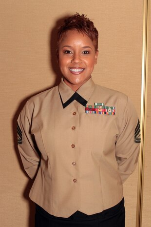Gunnery Sgt. Shavon N. Nicholson, 11th Marine Regiment career planner, 1st Marine Division, received the Guadalcanal Trophy for outstanding achievement in 2013 on behalf of her team of career planners during the 1st Marine Division Annual Career Planning Awards Luncheon at Marine Corps Base Camp Pendleton, Calif., Jan. 27, 2014. Nicholson, a native of Axton, Va., supervises career planners who assist in serving more than 25,000 combat-ready Marines and Sailors throughout 1st Marine Division. Career planners are responsible for interviewing Marines several times during their careers and assisting them in reenlisting , transitioning successfully to civilian life or pursuing higher education. (U.S. Marine Corps photo by Sgt. Jacob H. Harrer / released)