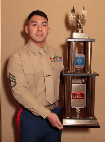 Staff Sgt. Anourack D. Phavorachith, career planner, 3rd Battalion, 11th Marine Regiment, received the Inchon Trophy for outstanding achievement in 2013 during the 1st Marine Division Annual Career Planning Awards Luncheon at Marine Corps Base Camp Pendleton, Calif., Jan. 27, 2014. Phavorachith, a 30-year-old native of Fresno, and 2001 graduate of Hoover High School, is assigned to an artillery battalion based in Marine Corps Air Ground Combat Center Twentynine Palms. He is required to interview Marines in the battalion several times throughout their careers and assist them in reenlisting, transitioning successfully to a civilian career or pursuing higher education.  Phavorachith is one of many career planners serving more than 25,000 combat-ready Marines and Sailors throughout 1st Marine Division.
(U.S. Marine Corps photo by Sgt. Jacob H. Harrer / released)
