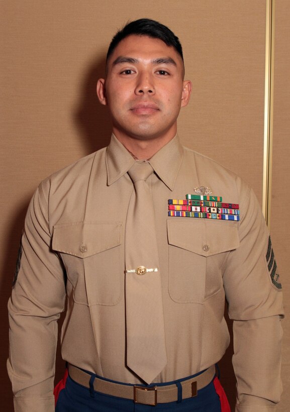 Staff Sgt. Anourack D. Phavorachith, career planner, 3rd Battalion, 11th Marine Regiment, received the Inchon Trophy for outstanding achievement in 2013 during the 1st Marine Division Annual Career Planning Awards Luncheon at Marine Corps Base Camp Pendleton, Calif., Jan. 27, 2014. Phavorachith, a 30-year-old native of Fresno, and 2001 graduate of Hoover High School, is assigned to an artillery battalion based in Marine Corps Air Ground Combat Center Twentynine Palms. He is required to interview Marines in the battalion several times throughout their careers and assist them in reenlisting, transitioning successfully to a civilian career or pursuing higher education. Phavorachith is one of many career planners serving more than 25,000 combat-ready Marines and Sailors throughout 1st Marine Division.
 (U.S. Marine Corps photo by Sgt. Jacob H. Harrer / released)

